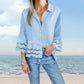 Bluse mit einfarbigem Revers, ausgestellten Ärmeln und Cut-out am Saum