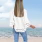 Bluse mit einfarbigem Revers, ausgestellten Ärmeln und Cut-out am Saum