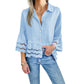 Bluse mit einfarbigem Revers, ausgestellten Ärmeln und Cut-out am Saum
